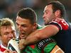 SYDNEY, AUSTRALIA - SEPTEMBER 26: Sam Burgess of the Rabbitohs is tackled by Sam Moa, Jake Friend and Boyd Cordner during the First Preliminary Final match between the South Sydney Rabbitohs and the Sydney Roosters at ANZ Stadium on September 26, 2014 in Sydney, Australia. (Photo by Renee McKay/Getty Images)