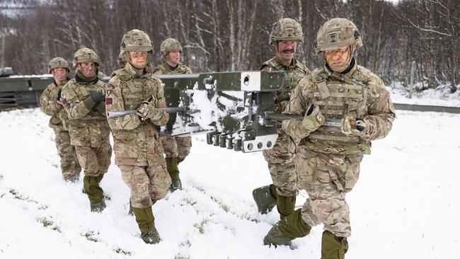 Britain’s Royal Engineers build a bridge in Telneset, Norway, yesterday. The Dutch neglected to order cold-weather clothing for their contingent. Picture: Getty Images