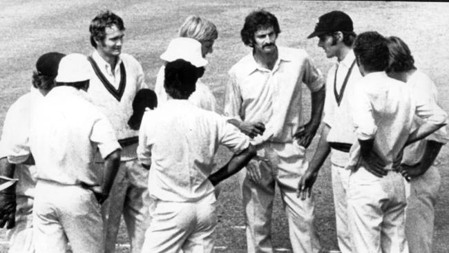 Dennis Lillee is congratulated by teammates after breaking the record for wickets in a Test series.