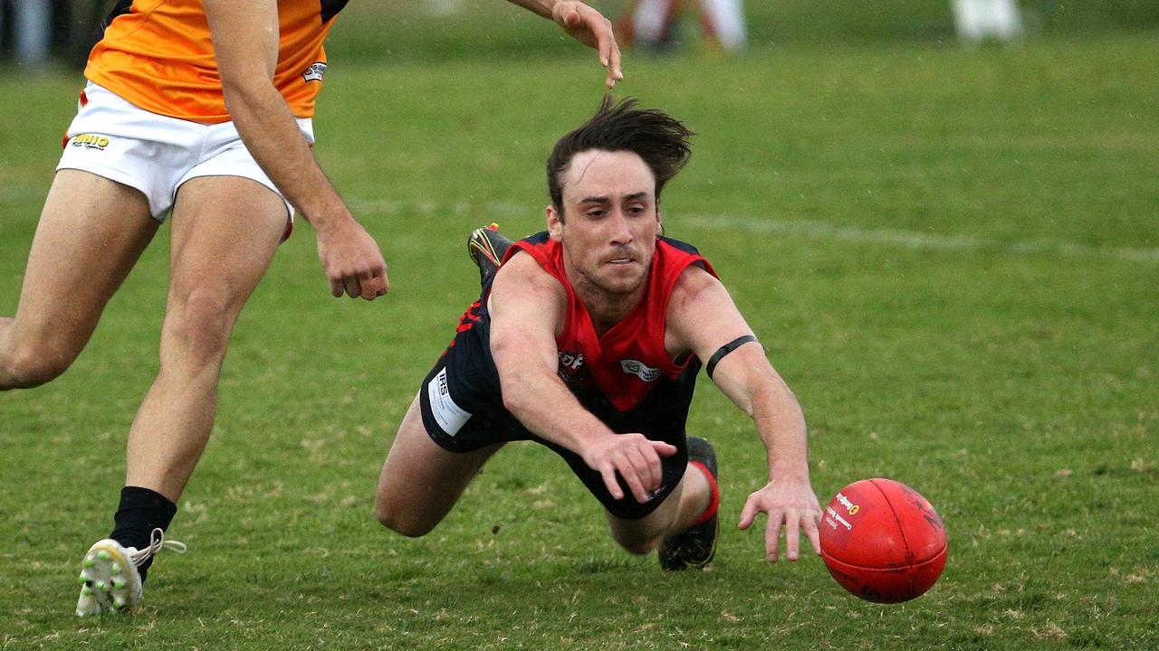 Essendon District: Tullamarine’s Samuel Laffan dives for the ball against East Keilor. Picture: Hamish Blair