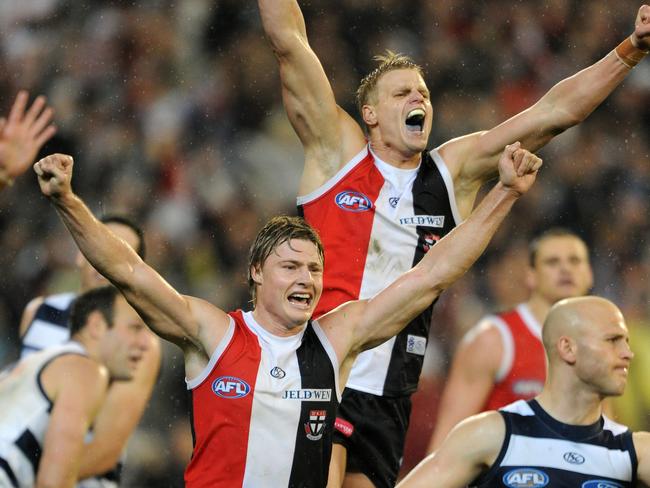 Nick Riewoldt and Clint Jones celebrate as the siren sounds.