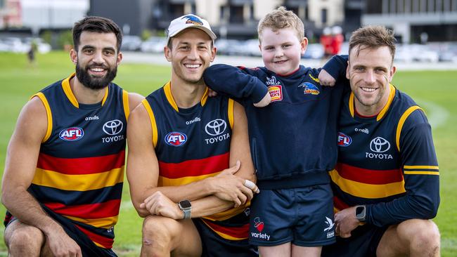 Seven-year-old Crows fan Nash Holmes with Crows Wayne Milera, Tom Doedee and Brodie Smith. Picture: Mark Brake