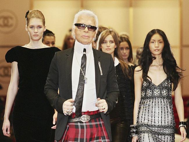 (COMBO) This combination of pictures created on February 19, 2019 shows (FromL) German designer Karl Lagerfeld in Tokyo on 03 December 2004, Lagerfeld in Paris during autumn/winter 2009 ready-to-wear collection and Lagerfeld in Paris on 03 October 2007. AFP PHOTO/Toru YAMANAKA / Patrick KOVARIK / Pierre VERDY / - German fashion designer Karl Lagerfeld has died at the age of 85, it was announced on February 19, 2019. (Photos by AFP)