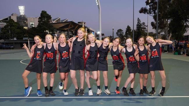 Newtown Mather under-11 netball team pull their funniest faces.