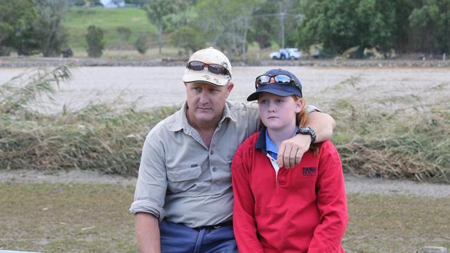 Three dead in Tweed River tragedy. Matt Grinham and son Thomas, 15, used a depth sounder to locate the car in the river at Tumbulgum. Picture: Glenn Hampson