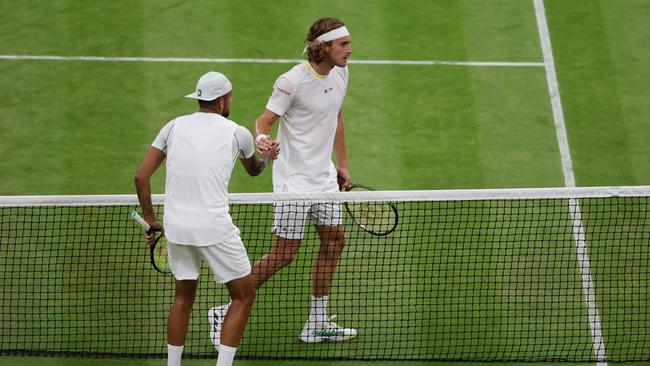 Nick Kyrgios and Stefanos Tsitsipas exchange a frosty handshake after their match. Picture: Clive Brunskill/Getty