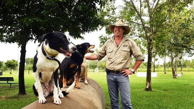 Will Green with some of his rescue dogs and closest mates, Bonnie, Yap and Betty at the Marlow Lagoon Dog Park ... the park will be a major beneficiary of Palmerston’s 2020/2021 budget