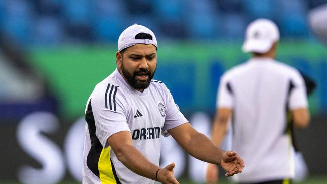 India's captain Rohit Sharma said he couldn’t believed he dropped the catch. (Photo by Jewel SAMAD / AFP)