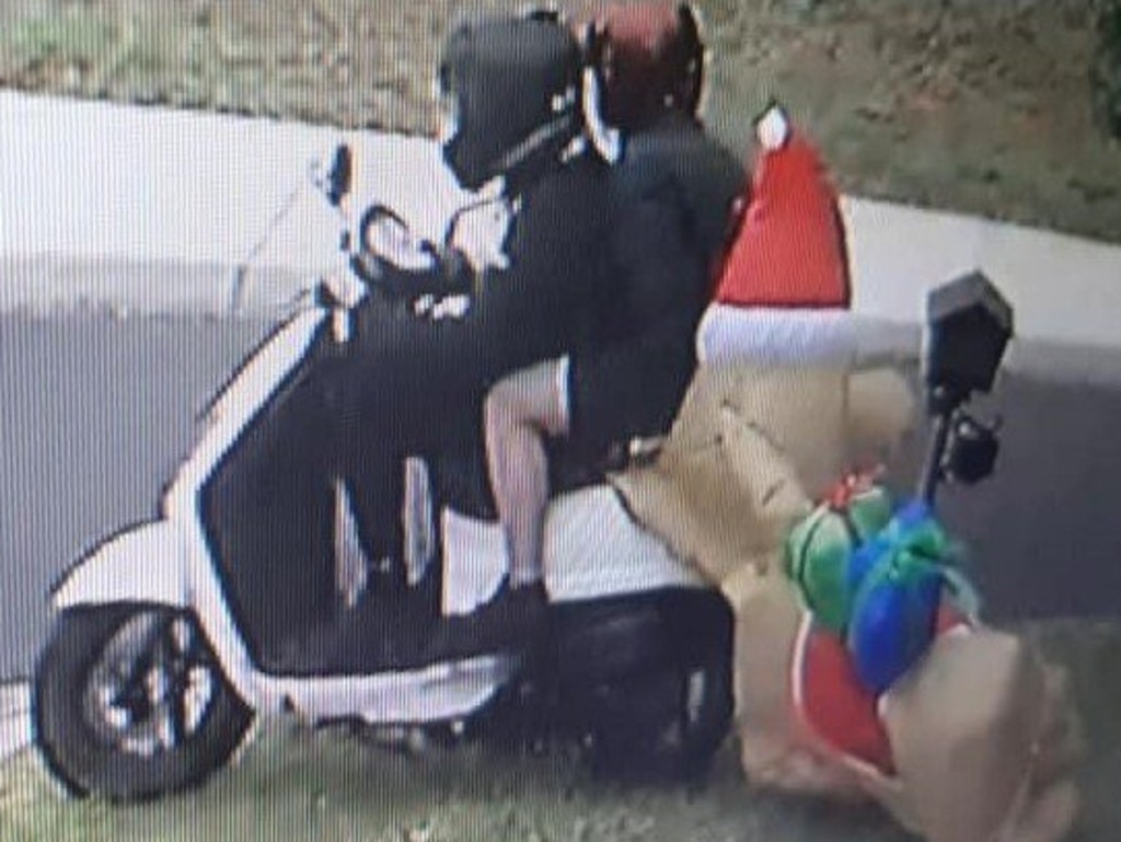 Police are searching for two people on a scooter who stole an inflatable Christmas dog decoration from a house in Hoppers Crossing.