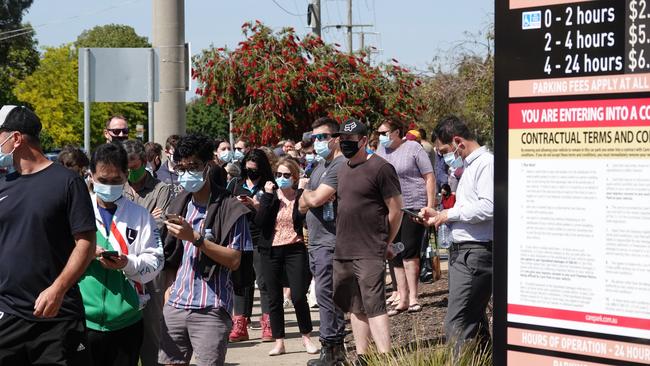 People queue to get checked outside the main hospital in Shepparton. Picture: Alex Coppel.