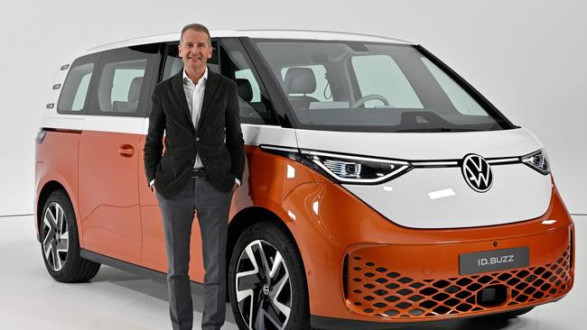 Volkswagen Group Chief Executive Officer Herbert Diess poses with the new Volkswagen ID Buzz electric van during its presentation in Hamburg, northern Germany.