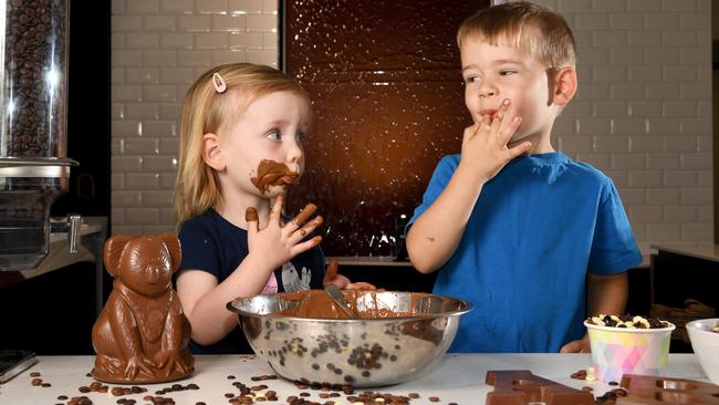 Chocolate fans Finley and Noah have fun with their favourite sweet treat. Picture: Tricia Watkinson