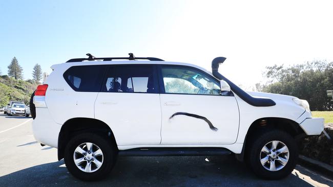 One of several Queensland registered cars that have been vandalised with black spray paint at Duranbah Beach, Tweed Heads. Photo: Scott Powick