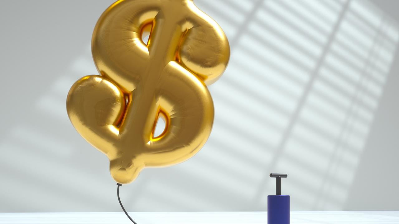 Digital generated image of golden air balloon in shape of dollar sign inflated using pump and flying up on white background. Inflation concept.