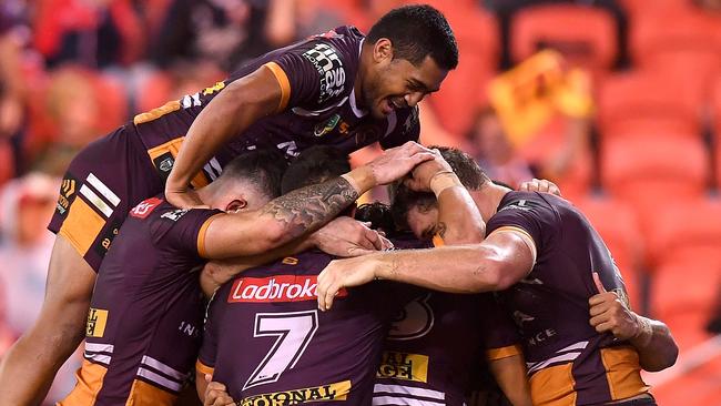 Broncos players celebrate Jamayne Isaako’s match-sealing try on Friday night.