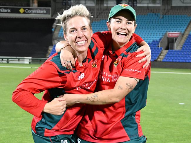 Elyse Villani and Heather Graham of the Tasmanian Tigers after winning a third straight WNCL title. (Photo by Steve Bell/Getty Images)