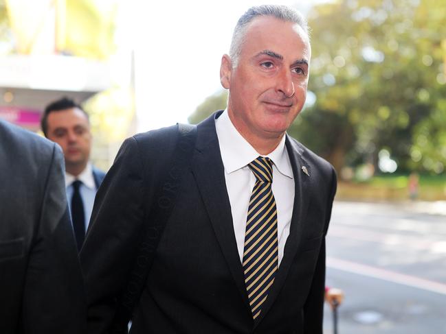 SYDNEY, AUSTRALIA - NewsWire Photos MARCH 29, 2021 -  Liberal MP John Sidoti (centre with black stripy tie) and his legal team arriving at his ICAC hearing in Sydney.Picture: NCA NewsWire / Christian Gilles