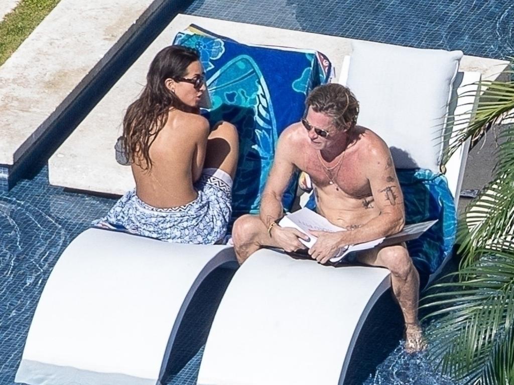 Shirtless Brad Pitt sunbathes with topless Ines de Ramon on Cabo trip