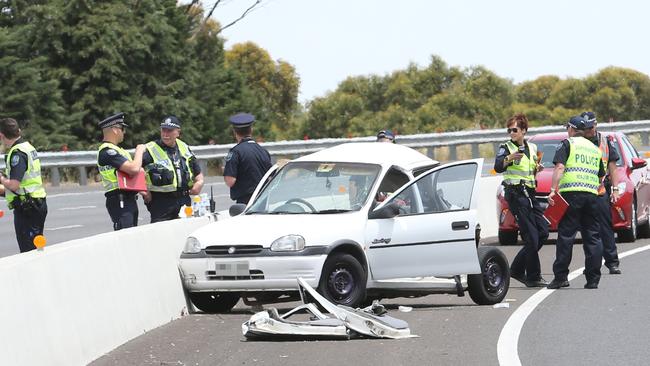 Police at the scene of the Southern Expressway crash. Picture: Stephen Laffer