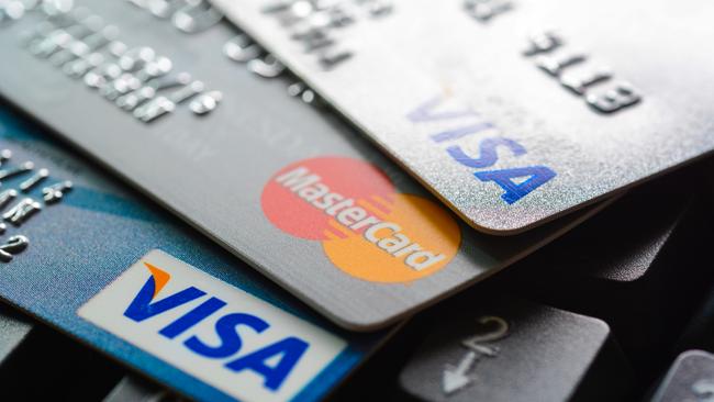 Bangkok, Thailand - Jun 23, 2015 : Group of credit cards on computer keyboard with VISA and MasterCard brand logos