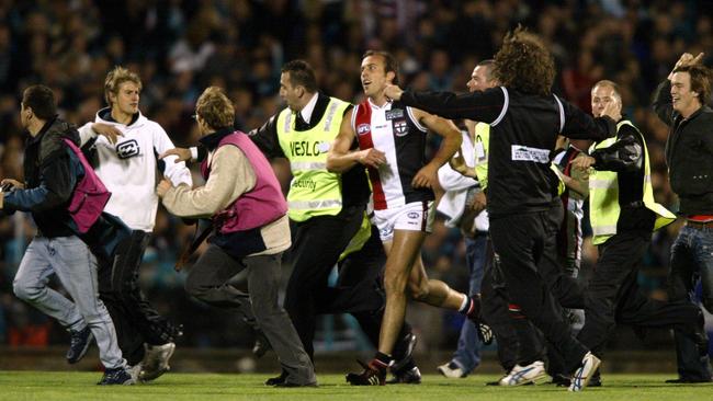 Fans surge on to AAMI Stadium after Fraser Gehrig kicked his 100th goal for the season in the 2004 prelim.