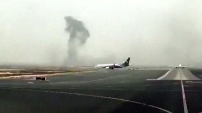 Smoke rising after an Emirates flight crash landed at Dubai International Airport. Picture: AP