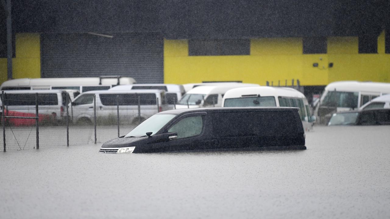 A vehicle is submerged in flood water in the suburb of Oxley in Brisbane. (Photo by Dan Peled/Getty Images)