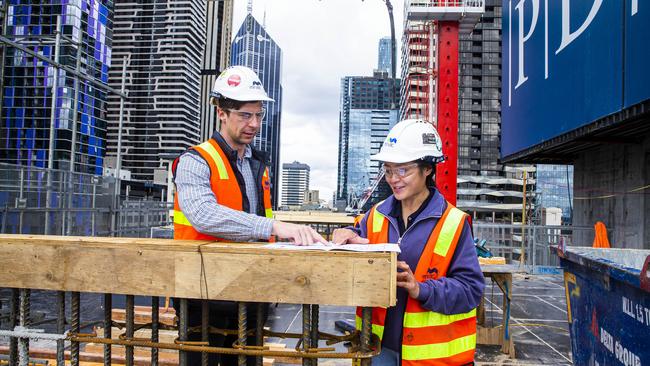 Site engineers Chris Nixon and Jo Cheng at a Mirvac development in Melbourne on Monday. Picture: Aaron Francis