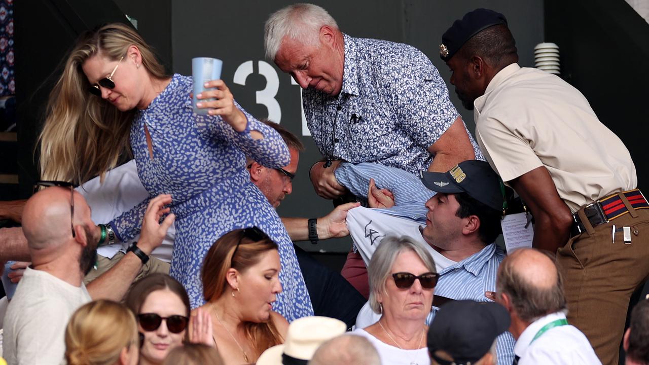 Drew Pavlou is removed by security during the Wimbledon men's singles final. Picture: Ryan Pierse / Getty Images