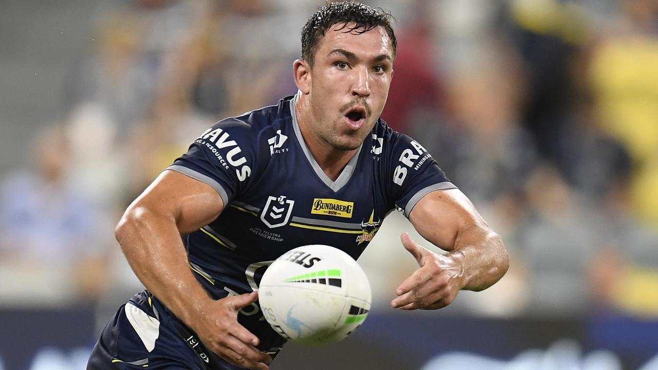 TOWNSVILLE, AUSTRALIA - SEPTEMBER 04: Reece Robson of the Cowboys passes the ball during the round 25 NRL match between the North Queensland Cowboys and the Manly Sea Eagles at QCB Stadium, on September 04, 2021, in Townsville, Australia. (Photo by Ian Hitchcock/Getty Images)
