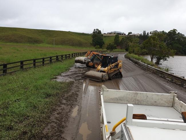 Tweed Shire Council workers have been working to clean up Dulguigan Rd in North Tumbulgum after floodwaters receded.