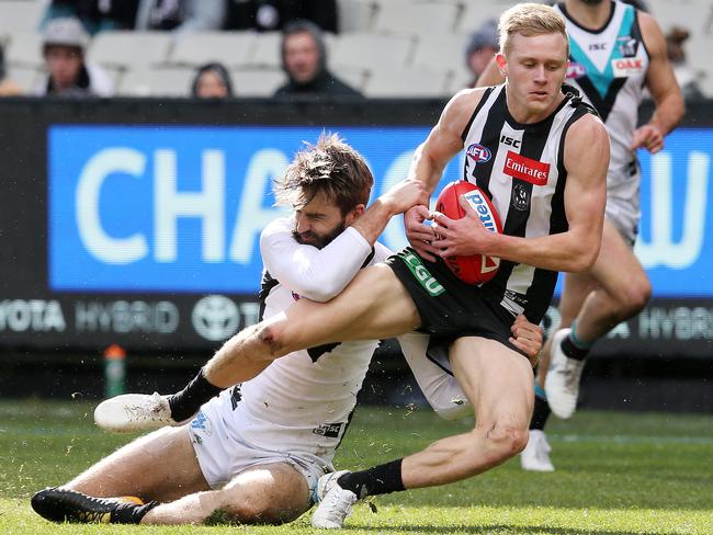 Justin Westhoff runs down Jaidyn Stephenson. Picture: Michael Klein