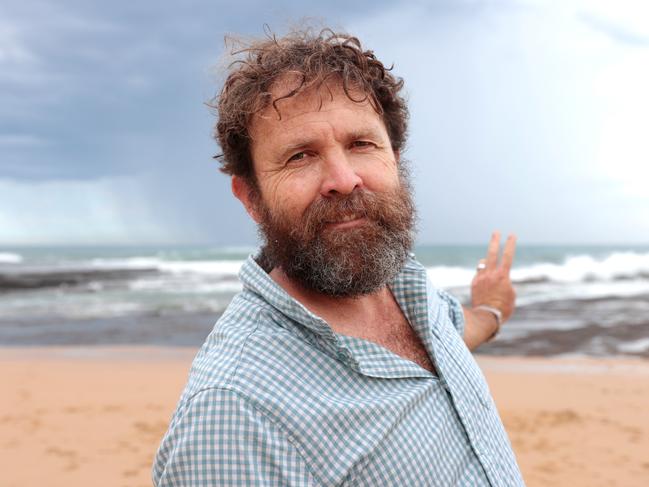 Renewable electricity advocate Saul Griffith at Austinmer Beach near Wollongong. A proposed wind farm off the coast would look to the naked eye approximately the size of half a fingernail according to Dr Griffith. Picture: Jane Dempster