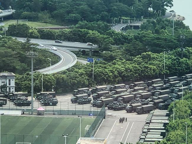 Trucks and armoured personnel carriers were seen making there way to the stadium. Picture: AFP