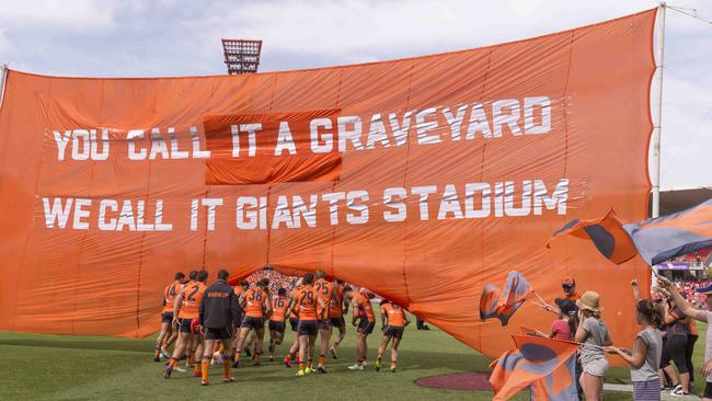 The Giants run through their banner before burying the Bombers. Pic: AAP