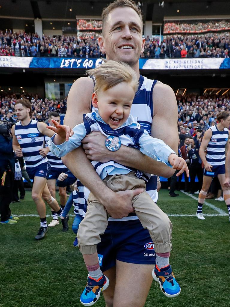 Joel Selwood carefully supports Levi Ablett. Picture: Getty Images