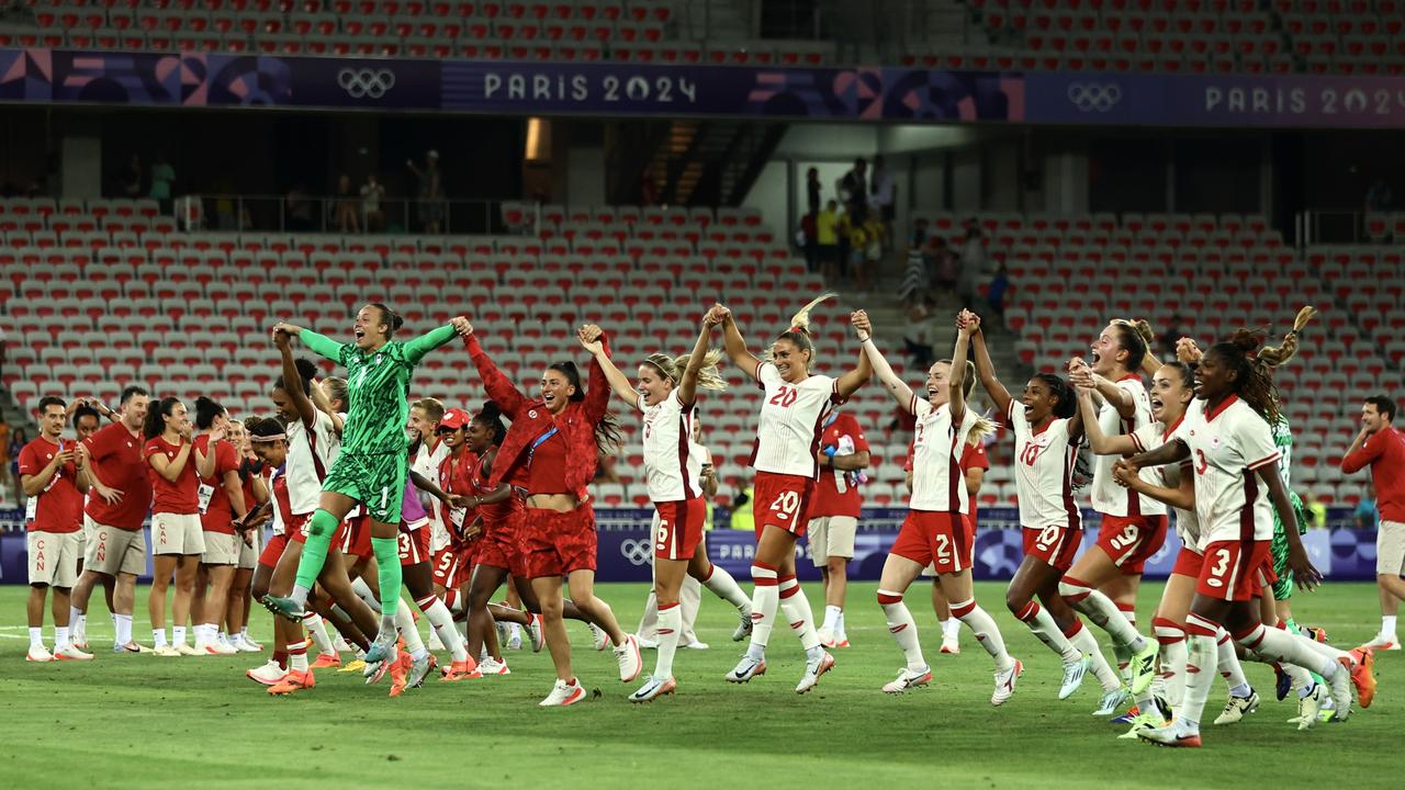 Team Canada celebrate after winning the women's group A match against Colombia in a 1-0 result that sealed the fate of the Matildas. Picture: Marc Atkins/Getty Images