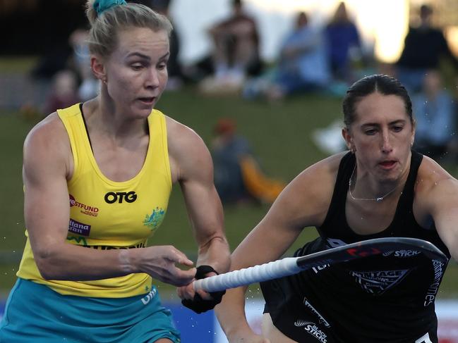 PERTH, AUSTRALIA - JUNE 26: Stephanie Kershaw of the Hockeyroos and Stephanie Dickins of the Black Sticks contest for the ball during the FIH Pro League match between the Australian Hockeyroos and the New Zealand Black Sticks at Perth Hockey Stadium on June 26, 2021 in Perth, Australia. (Photo by Paul Kane/Getty Images)