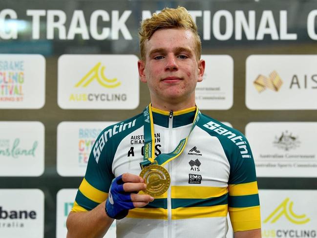 Sam McKee with one of the gold medals he won at the recent national junior track championships. Picture: Andrew Trovas