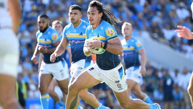 Tino Fa'asuamaleaui of the Titans makes a run during the round three NRL match between the Gold Coast Titans and the Melbourne Storm at Cbus Super Stadium on March 18, 2023 in Gold Coast, Australia. (Photo by Jono Searle/Getty Images)