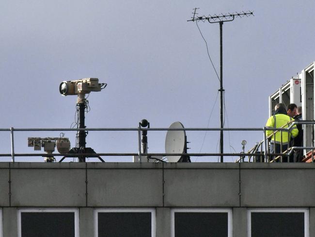 Counter drone equipment is deployed on a rooftop at Gatwick airport in Gatwick, England. Flights resumed after drones sparked about 36 hours of travel chaos including the shutdown of the airfield, leaving tens of thousands of passengers stranded or delayed. Picture: AP