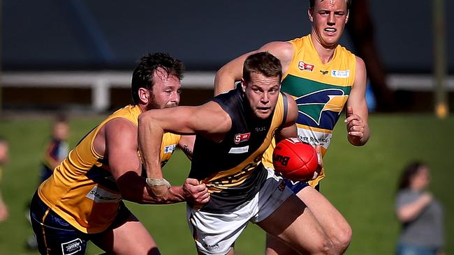 Woodville-West Torrens star Angus Rowntree tackles Glenelg's Riley McFarlane. Picture: Dean Martin