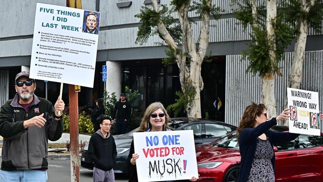 People participate in a "TeslaTakedown" protest against Elon Musk outside of a Tesla dealership in Irvine, California, March 1, 2025. Picture: Frederic J. BROWN / AFP