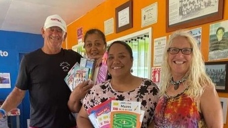 Gordon Grivas "Yotsie" and friend Kylie Young taking supplies to a school on Aitutaki, Cook Islands. Photo: GoFundMe