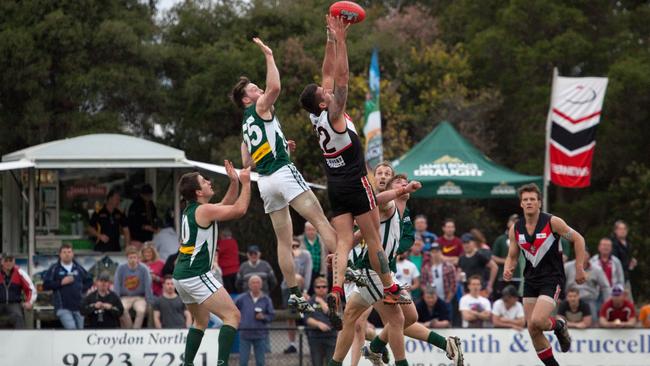 South Belgrave’s Leigh Odermatt flies for a mark. Photo: Mitch Getson