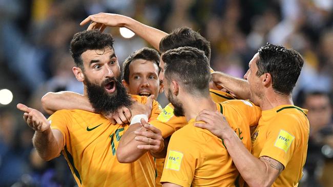 Australia's Mile Jedinak celebrates scoring a goal against Honduras.