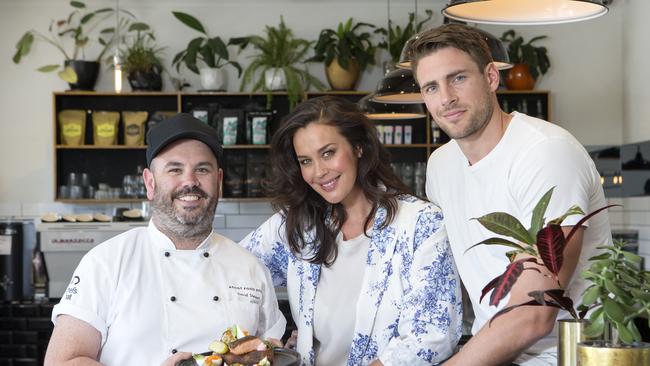 Megan Gale and Shaun Hampson at Ascot Food Store, the Moonee Ponds cafe they've recently bought a share in with chef/co-owner Dave Stewart. Picture: Sarah Matray