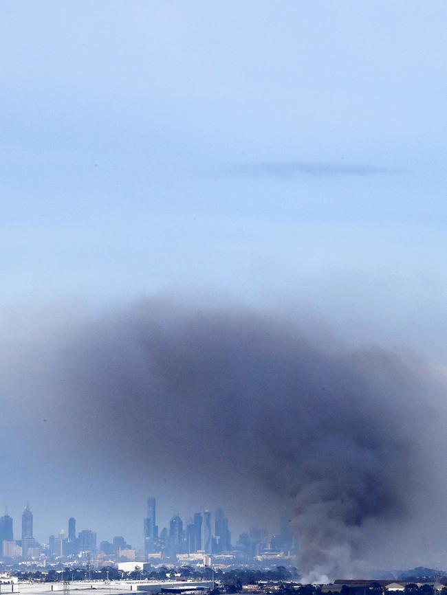 Toxic smoke and ash blew over Melbourne as the huge blaze burnt. Picture: Nicole Garmston