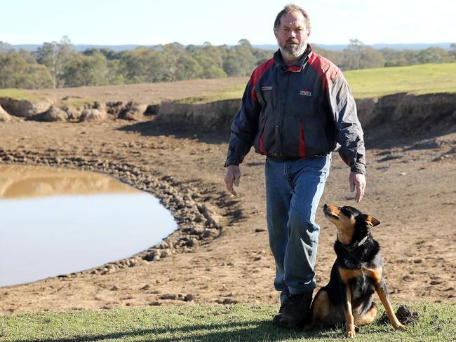 Dairy Farmer Brett Hayter with his dog Bobby at their Werombi property on the outskirts of Sydney. Picture: Tim Hunter.