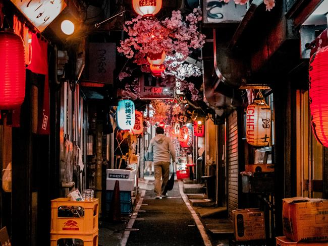 The narrow, yakitori-lined alley of Omoide Yokocho in Golden Gai. Picture: Unsplash.com/kennreynon